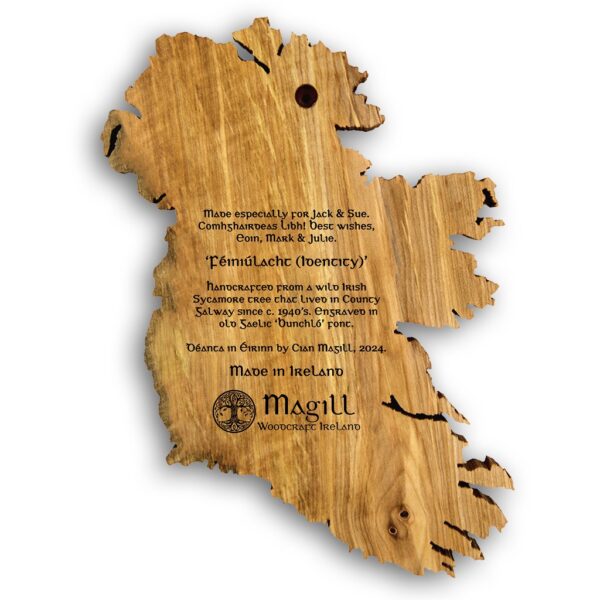 Back view of a personalised wooden map of Ireland wall art, engraved with a message to the recipient. The engraved text also displays; "handcrafted from a 1940's Irish Sycamore tree of County Galway and Made in Ireland by Magill Woodcraft Ireland".